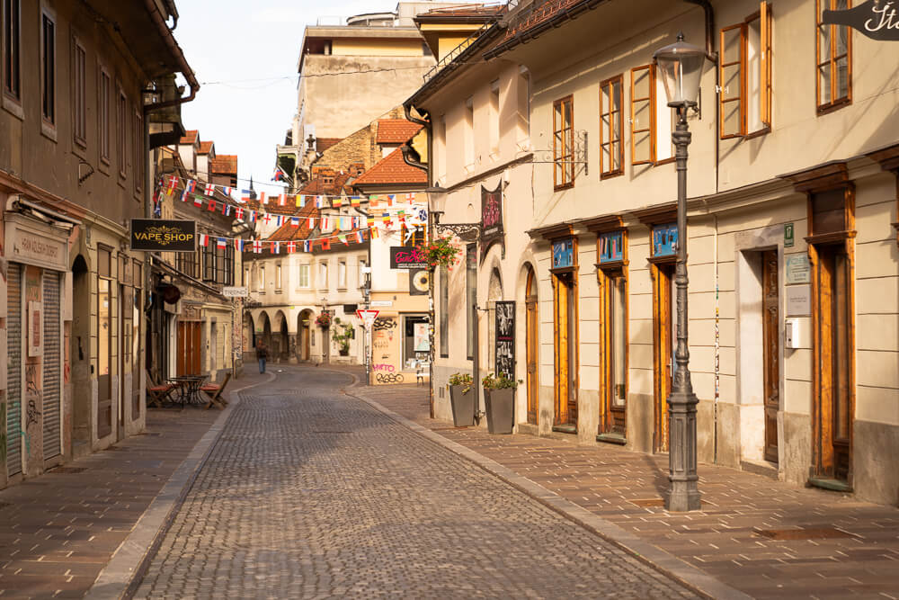 Ljubljana old town street with golden sunlight
